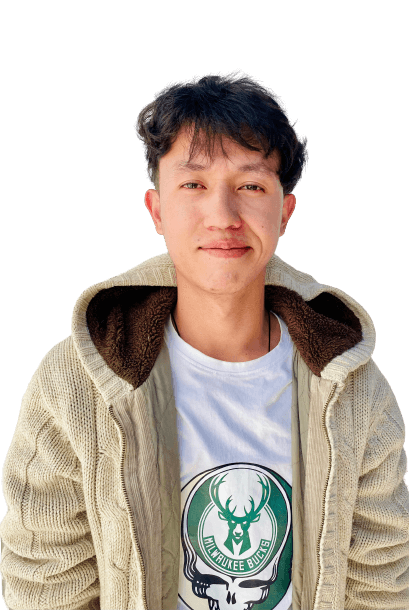 Jigme Lodey smiling in front of a background